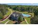 An attractive gray home with a private pool and lush landscaping, creating a serene outdoor oasis at 335 Discovery Lake Dr, Fayetteville, GA 30215