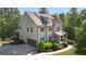 Charming two-story home with a covered front porch, manicured landscaping, and attached two-car garage at 335 Discovery Lake Dr, Fayetteville, GA 30215