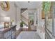 Inviting foyer with hardwood floors, staircase, elegant decor, and views into adjacent living spaces at 335 Discovery Lake Dr, Fayetteville, GA 30215