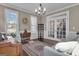 Comfortable living room with hardwood floors, neutral paint, large windows, piano, and elegant decor at 335 Discovery Lake Dr, Fayetteville, GA 30215