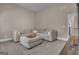 Carpeted living room with large sectional couch, neutral walls and lots of seating space at 335 Discovery Lake Dr, Fayetteville, GA 30215