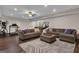 This wide angle of the living room shows seating, decor and an exercise area beyond at 335 Discovery Lake Dr, Fayetteville, GA 30215