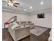 This living room has recessed lights, a ceiling fan, dark floors and comfortable seating at 335 Discovery Lake Dr, Fayetteville, GA 30215