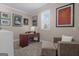 Cozy office space with natural light, complemented by a comfortable armchair and ottoman at 335 Discovery Lake Dr, Fayetteville, GA 30215