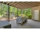 Covered patio area with ample space for outdoor seating and access to the expansive backyard at 335 Discovery Lake Dr, Fayetteville, GA 30215
