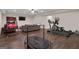 Recreation room with workout equipment and sitting area, offering entertainment and exercise at 335 Discovery Lake Dr, Fayetteville, GA 30215