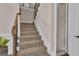 Carpeted staircase with wooden banister and white trim, leading to the upper level at 335 Discovery Lake Dr, Fayetteville, GA 30215