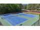 Overhead view of tennis courts surrounded by lush greenery offering a serene and active lifestyle at 335 Discovery Lake Dr, Fayetteville, GA 30215