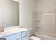 Sparkling bathroom with white vanity, generous mirror and modern fixtures. A refreshing oasis at 3865 Shelleydale Dr # 82, Powder Springs, GA 30127