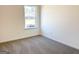 Bright bedroom with a window overlooking the neighborhood and plush carpeting at 3865 Shelleydale Dr # 82, Powder Springs, GA 30127