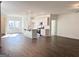 Open concept kitchen and living area features white cabinets, stainless appliances, and an island at 3865 Shelleydale Dr # 82, Powder Springs, GA 30127