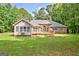Spacious backyard featuring a large wooden deck, perfect for outdoor entertaining at 250 Kari Glen Dr, Fayetteville, GA 30215