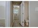 Entryway to secondary bathroom featuring tile floors, a toilet, and shiplap accent wall at 250 Kari Glen Dr, Fayetteville, GA 30215