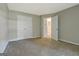Spacious bedroom featuring neutral walls, carpet, double door closet and an ensuite bathroom at 250 Kari Glen Dr, Fayetteville, GA 30215