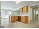 Functional eat-in kitchen featuring tile flooring and natural-finish wood cabinetry at 250 Kari Glen Dr, Fayetteville, GA 30215
