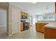 Well-equipped eat-in kitchen with tile floors, stainless appliances, and wood cabinetry at 250 Kari Glen Dr, Fayetteville, GA 30215