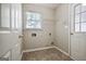 Practical laundry room with tile flooring and utility connections, and a side entry door at 250 Kari Glen Dr, Fayetteville, GA 30215