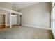 Bright living room with large windows and classic architectural details with carpet flooring at 250 Kari Glen Dr, Fayetteville, GA 30215