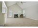 Bright living room features vaulted ceilings, a fireplace, and ample natural light at 250 Kari Glen Dr, Fayetteville, GA 30215
