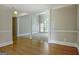 Bright, open living space with hardwood floors, decorative columns, and access to carpeted living room at 250 Kari Glen Dr, Fayetteville, GA 30215
