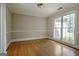 Office space featuring hardwood floors, light gray walls, white trim and a large window at 250 Kari Glen Dr, Fayetteville, GA 30215