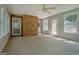 Bright sunroom with brick accent wall, many windows, and access to the exterior at 250 Kari Glen Dr, Fayetteville, GA 30215