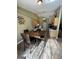 Charming dining area with tile flooring, pendant lighting, furniture, and view to kitchen at 4092 River Mist Ct, Lithonia, GA 30038