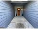 Cozy entryway featuring a wood door, decorative plants, and rock decor at 4092 River Mist Ct, Lithonia, GA 30038