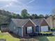 Overhead shot highlighting the home's architectural features, including two-car garage and well-kept yard at 4092 River Mist Ct, Lithonia, GA 30038