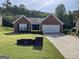 Charming brick home featuring a well-maintained lawn and driveway at 4092 River Mist Ct, Lithonia, GA 30038