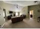 Bright living room with high ceilings, a fireplace, and multiple seating areas at 4092 River Mist Ct, Lithonia, GA 30038