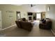 Spacious living room with a fireplace, TV, vaulted ceiling, neutral walls, carpet and furniture at 4092 River Mist Ct, Lithonia, GA 30038