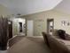 Inviting living room featuring neutral walls, vaulted ceiling and doorway to hallway and entry at 4092 River Mist Ct, Lithonia, GA 30038