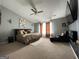 Spacious primary bedroom with a king bed, sitting area, and vaulted ceilings at 4092 River Mist Ct, Lithonia, GA 30038