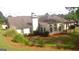 Backyard featuring a patio, lush lawn, mature landscaping, and a peaceful atmosphere at 4955 Highland Lakes Dr, South Fulton, GA 30349