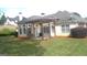 Enclosed backyard patio with a grill and bench provides a relaxing outdoor space at 4955 Highland Lakes Dr, South Fulton, GA 30349