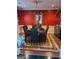 A stylish dining room, showcasing warm colors, and decorative chandelier for memorable gatherings at 4955 Highland Lakes Dr, South Fulton, GA 30349