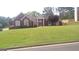 Charming brick home with manicured lawn and mature landscaping in a desirable location at 4955 Highland Lakes Dr, South Fulton, GA 30349