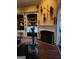 Cozy living room showcasing a fireplace, dark floors and custom shelving at 4955 Highland Lakes Dr, South Fulton, GA 30349