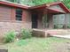 View of porch and front entrance of a single story house with brick foundation at 6154 Green Acres Sw Dr, Covington, GA 30014