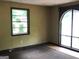 Interior living room showcasing a window and entryway with arched glass at 6154 Green Acres Sw Dr, Covington, GA 30014