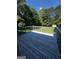 Outdoor deck featuring a gray wood grain, overlooking a spacious wooded backyard at 2204 Liberty Sw Ln, Conyers, GA 30094