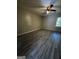 Bedroom with modern vinyl flooring and a ceiling fan providing comfort at 2204 Liberty Sw Ln, Conyers, GA 30094
