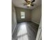 Cozy bedroom illuminated by natural light, enhanced by gray flooring and neutral walls at 2204 Liberty Sw Ln, Conyers, GA 30094
