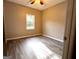 Sunlit bedroom enhanced with gray flooring and a ceiling fan at 2204 Liberty Sw Ln, Conyers, GA 30094
