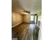 Bright bedroom with ceiling fan, neutral walls, and durable wood-look flooring for comfort and style at 2204 Liberty Sw Ln, Conyers, GA 30094
