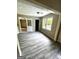 Well-lit dining area with new floors, bright window, and seamless transitions at 2204 Liberty Sw Ln, Conyers, GA 30094