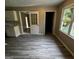 Bright dining area featuring new floors, a window, and seamless transitions at 2204 Liberty Sw Ln, Conyers, GA 30094