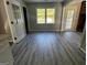 Dining area with new floors, bright window, and seamless transitions at 2204 Liberty Sw Ln, Conyers, GA 30094