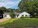 Attractive single-story house featuring a manicured lawn and shaded front yard at 2204 Liberty Sw Ln, Conyers, GA 30094